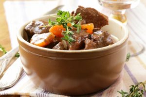 beef goulash (stew) with vegetables and herbs